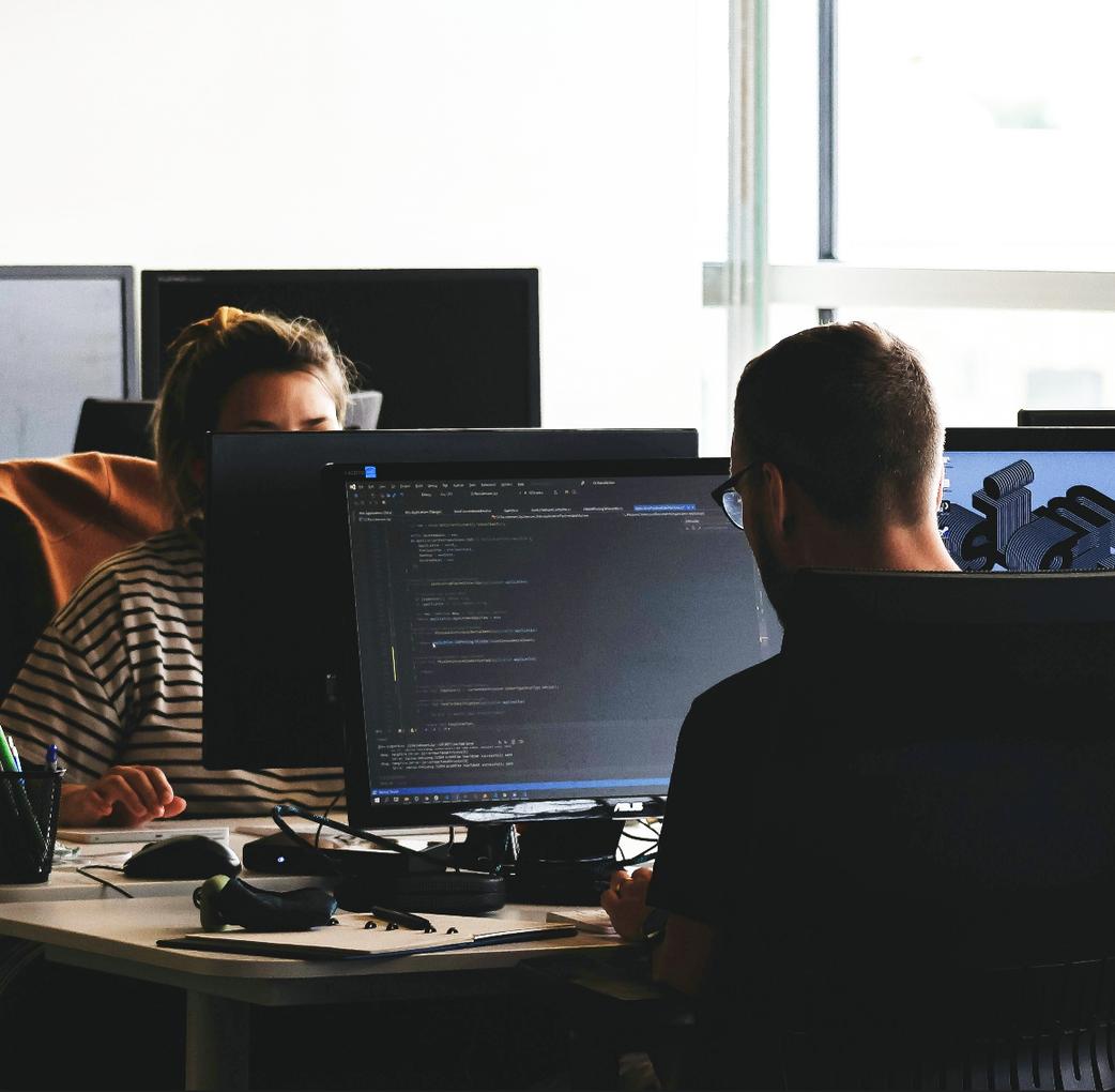 man and woman working in an office