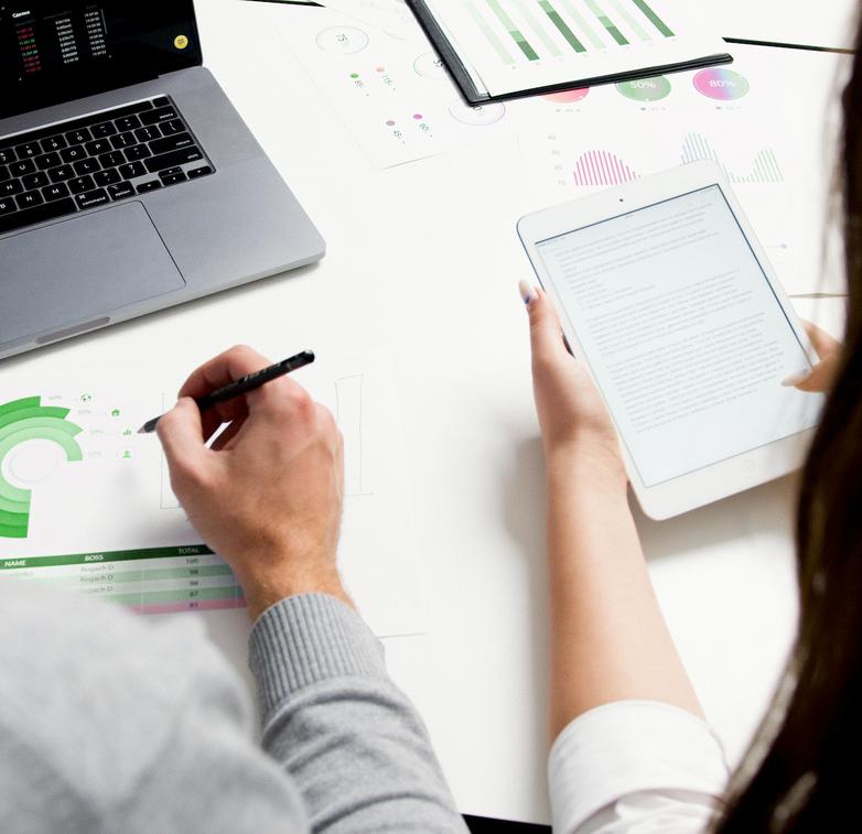 man and woman working on a desk