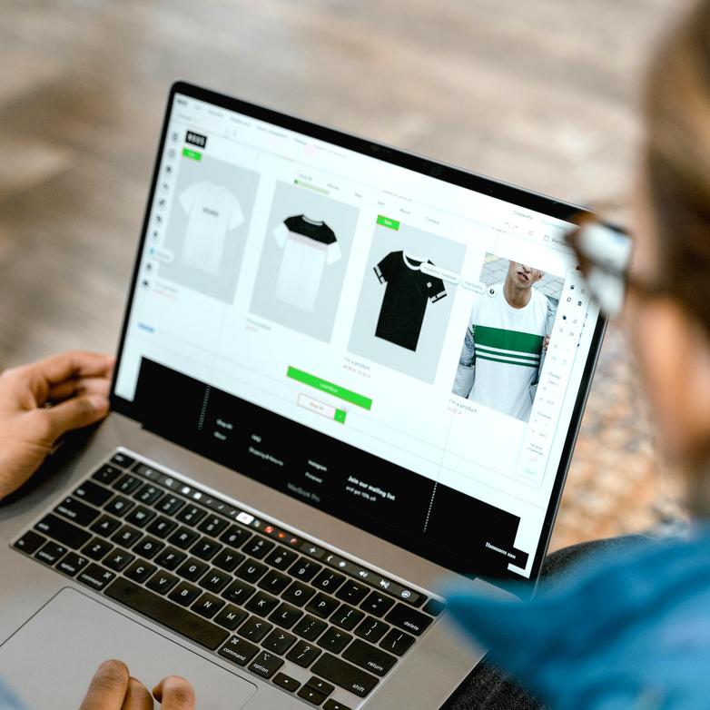 man and woman looking at a laptop screen